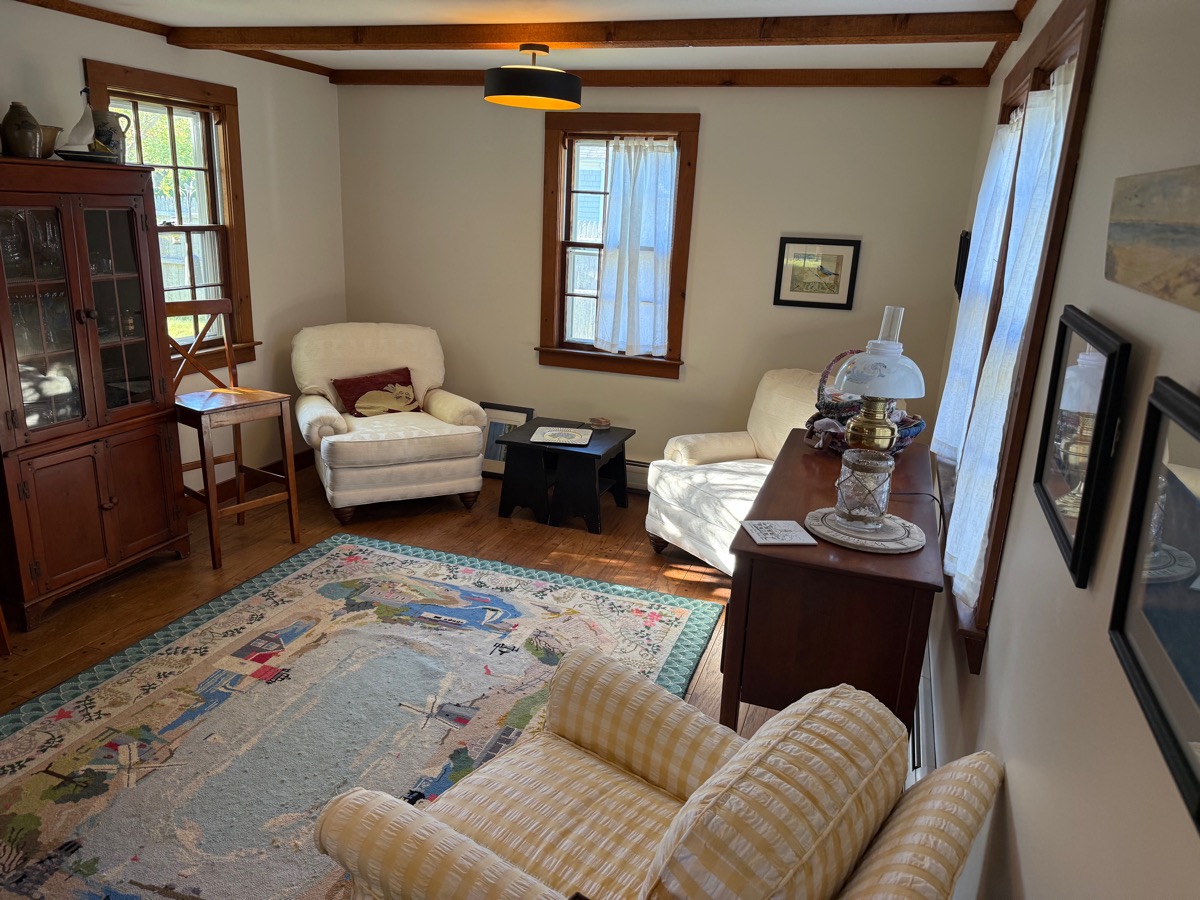 Living room seating area with china cabinet